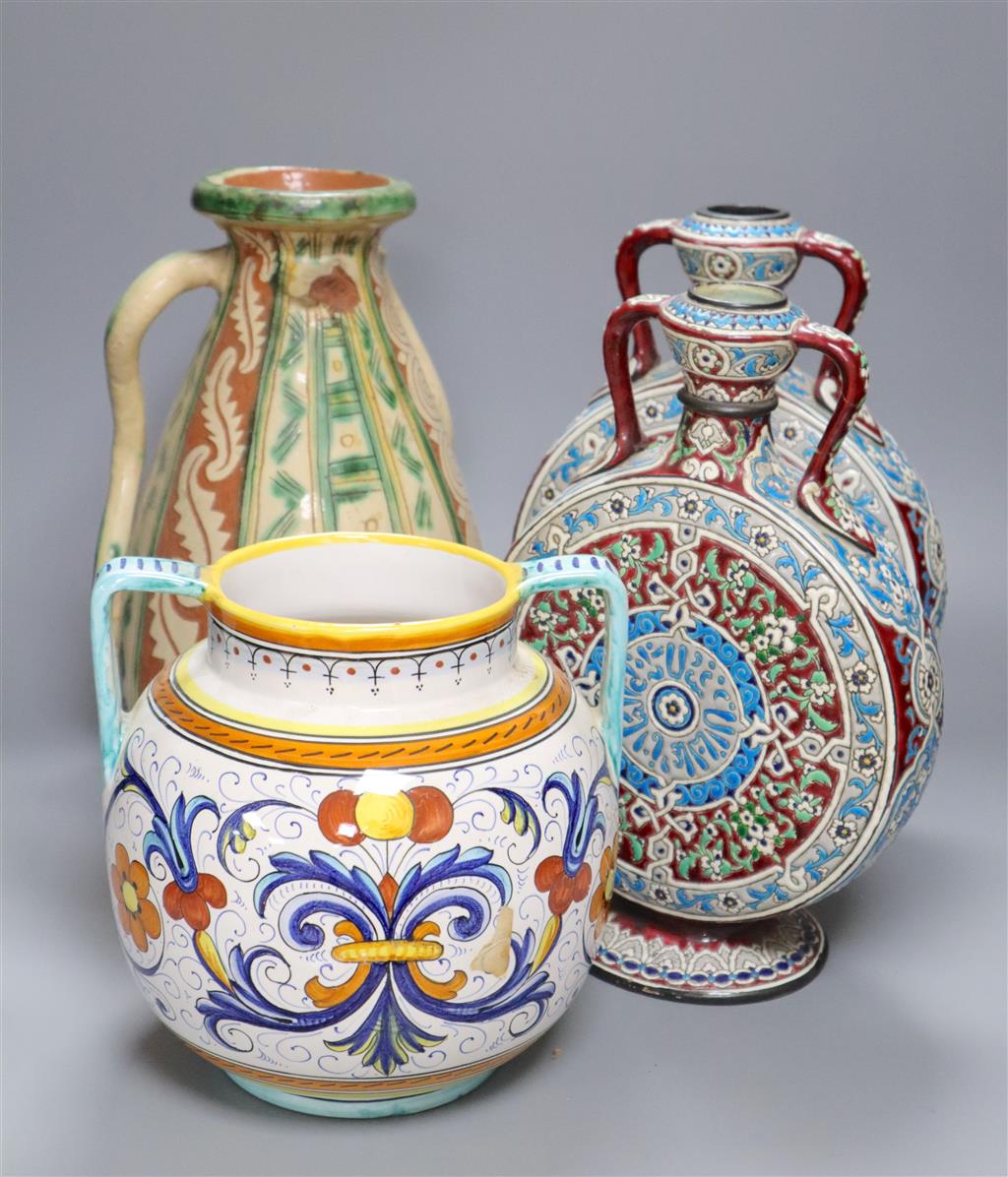 A pair of Isnik inspired pottery moon flasks, 30cm and an Italian pottery vase and another